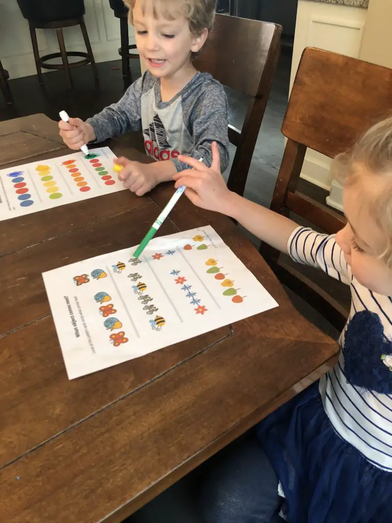 Kids working on preschool patterns workbook